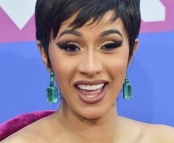 In picture, Cardi B flaunting her perfect teeth after surgery.